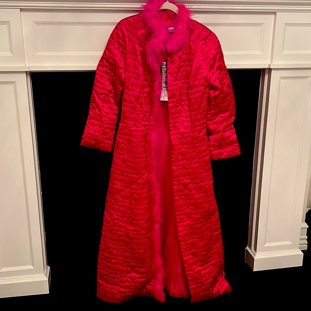 Bright pink long dramatic quilted long coat with feather collar